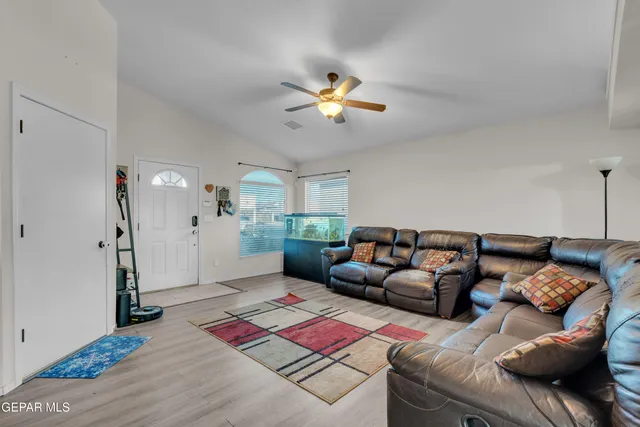 a living room with furniture and a rug