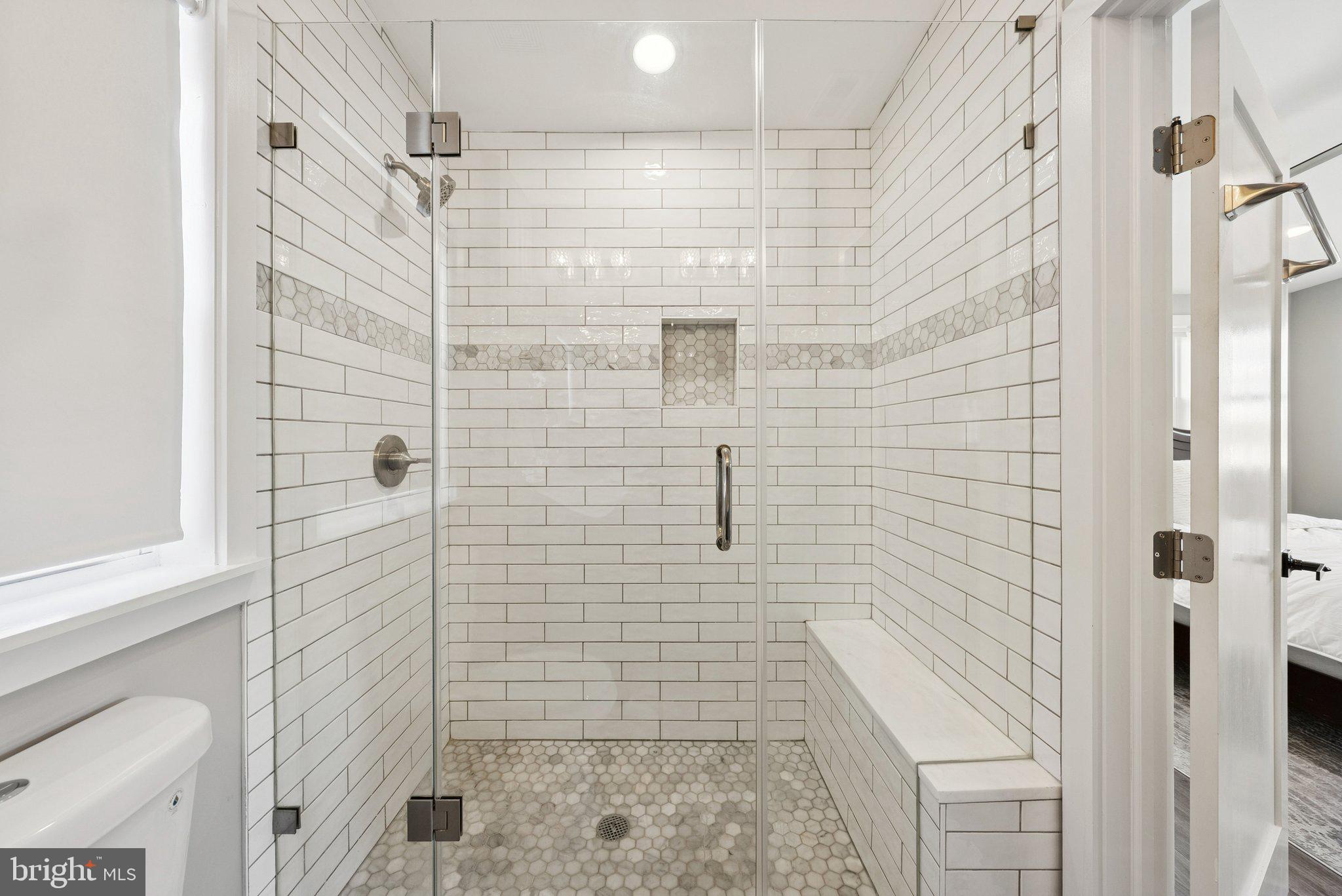 2116 R Street Northeast Washington, DC 20002 - Photo 24 of 42 Shower with bench and beautiful tile