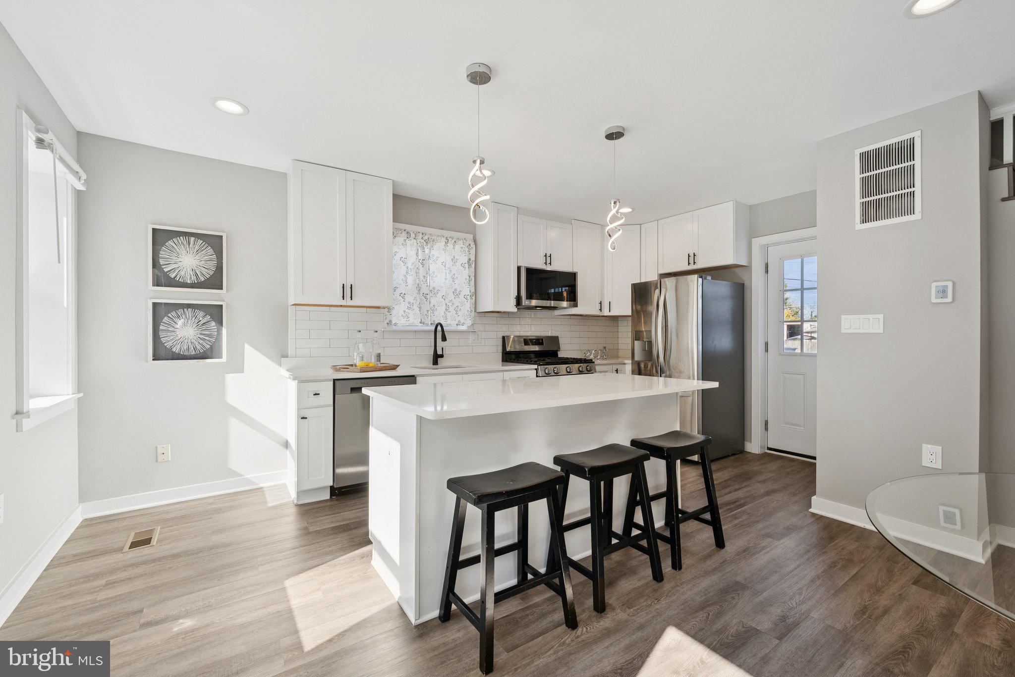 2116 R Street Northeast Washington, DC 20002 - Photo 8 of 42 Breakfast bar with pendant lighting