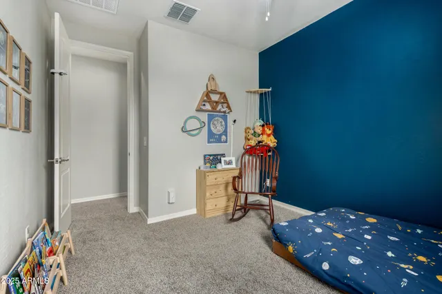 a room with furniture and a potted plant