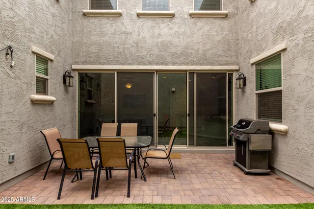 a outdoor space with a couch and chairs