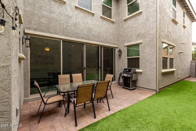 a view of yard with patio