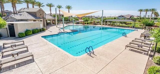 a view of a swimming pool with a patio