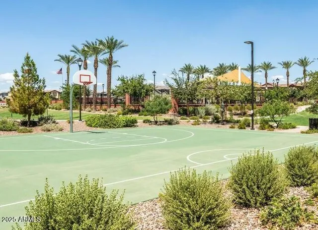 a swimming pool with an outdoor space and seating area