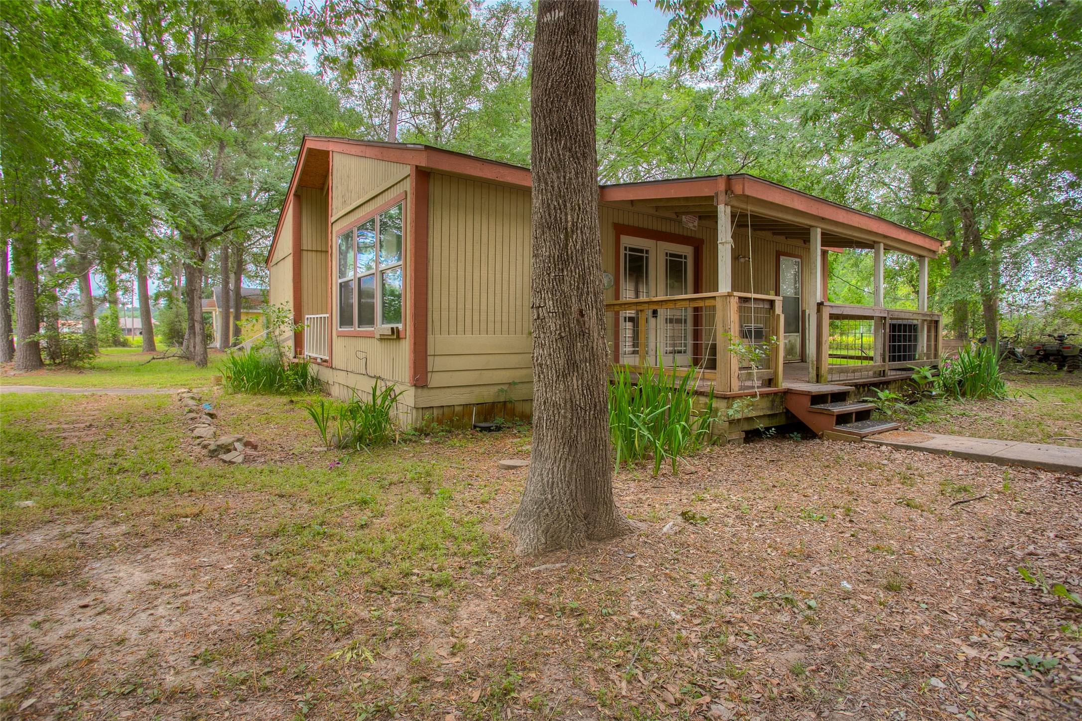 81 Westlake Road Trinity, TX 75862 - Photo 21 of 23 a front view of a house with garden