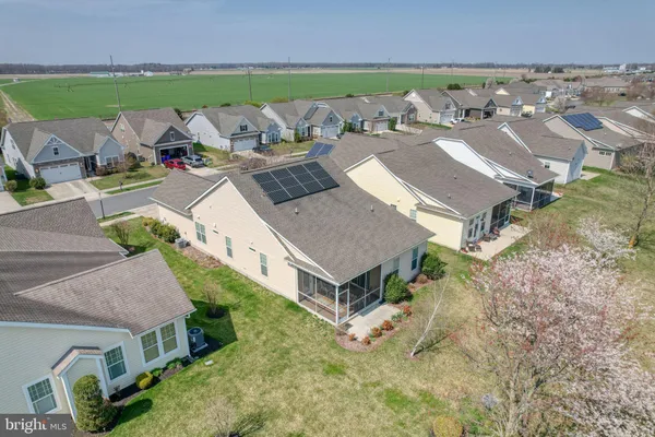 an aerial view of a house with a lake view