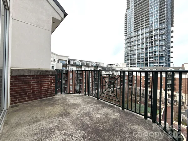 a view of a balcony with a fence