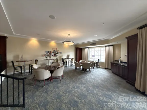 a view of dining room with furniture and chandelier