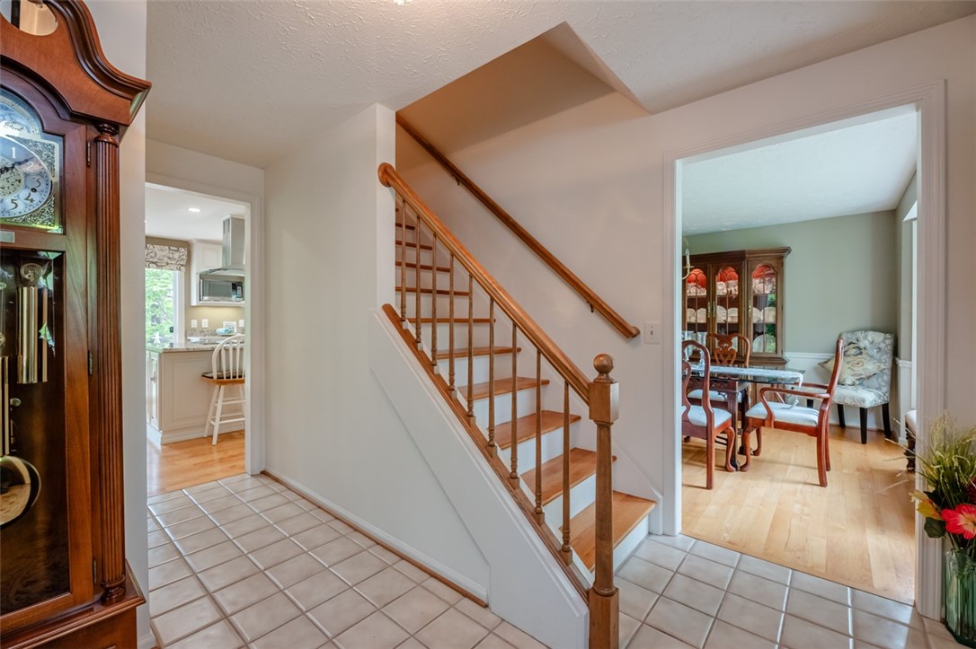 77 Misty Pine Road Perinton, NY 14450 - Photo 6 of 47 THE FOYER OPENS TO THE LIVING ROOM, DINING ROOM AN
