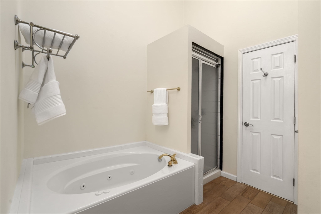 11 Cow Hill Road Sharon, MA 02067 - Photo 23 of 30 a bathroom with a tub shower and vanity