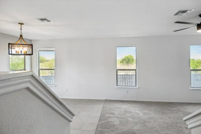 a bathroom with a sink a toilet a mirror and shower