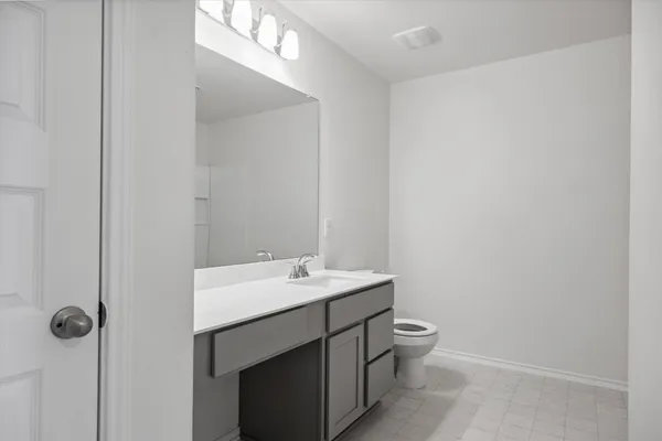 an empty room with closet area