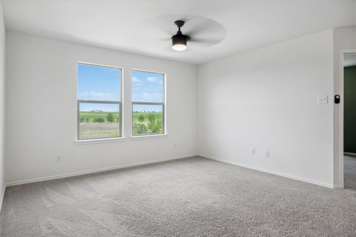 925 Yellow Ribbon Trail Jarrell, TX 76537 - Photo 19 of 35 a view of an empty room with a window