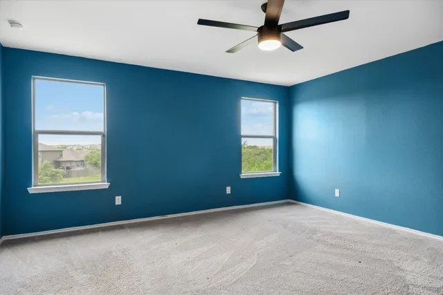 a view of a livingroom with a ceiling fan