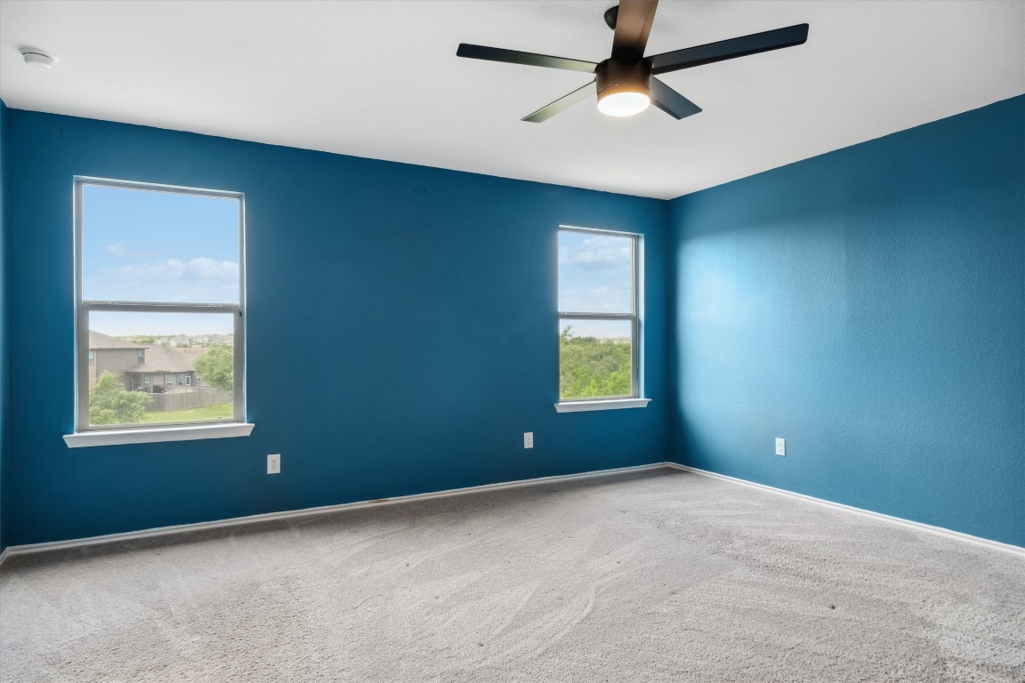 925 Yellow Ribbon Trail Jarrell, TX 76537 - Photo 22 of 35 an empty room with windows and closet