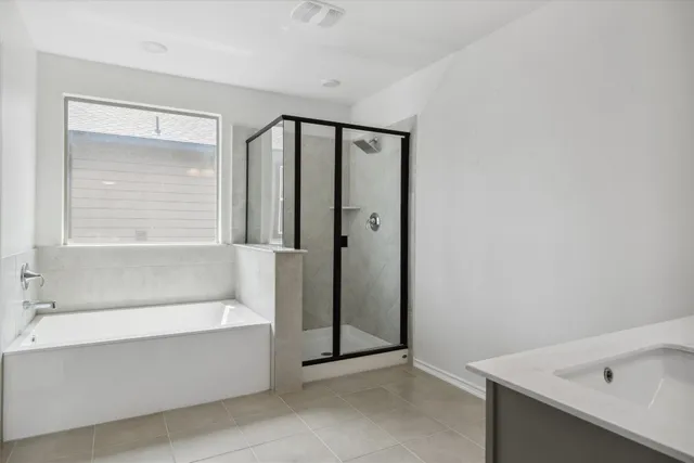 a bathroom with a sink vanity and mirror