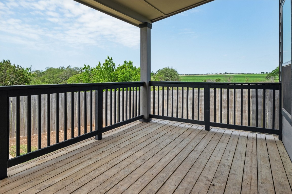 925 Yellow Ribbon Trail Jarrell, TX 76537 - Photo 31 of 35 a balcony with wooden floor and fence