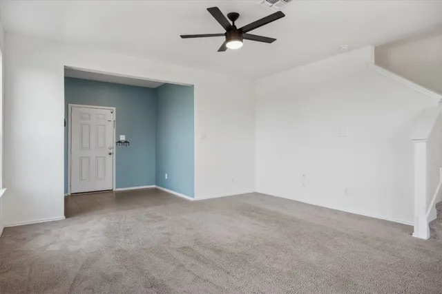 a kitchen with stainless steel appliances granite countertop a stove a sink a refrigerator a microwave a counter top and cabinets