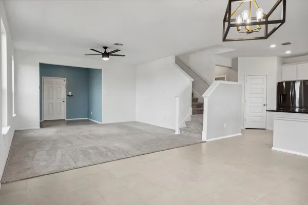 a kitchen with stainless steel appliances granite countertop a refrigerator sink and microwave