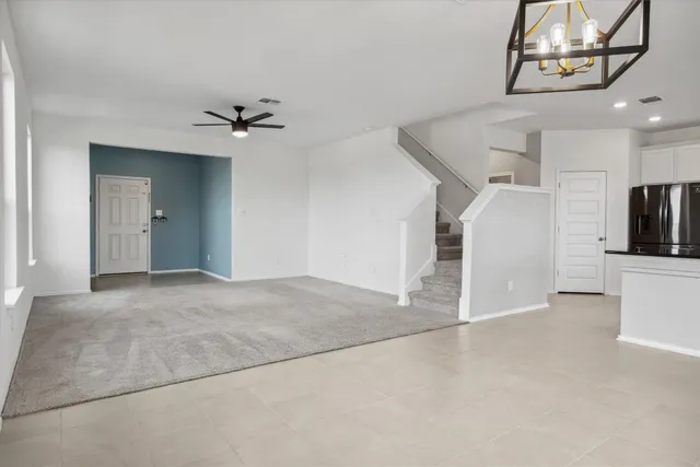 a kitchen with stainless steel appliances granite countertop a refrigerator sink and microwave