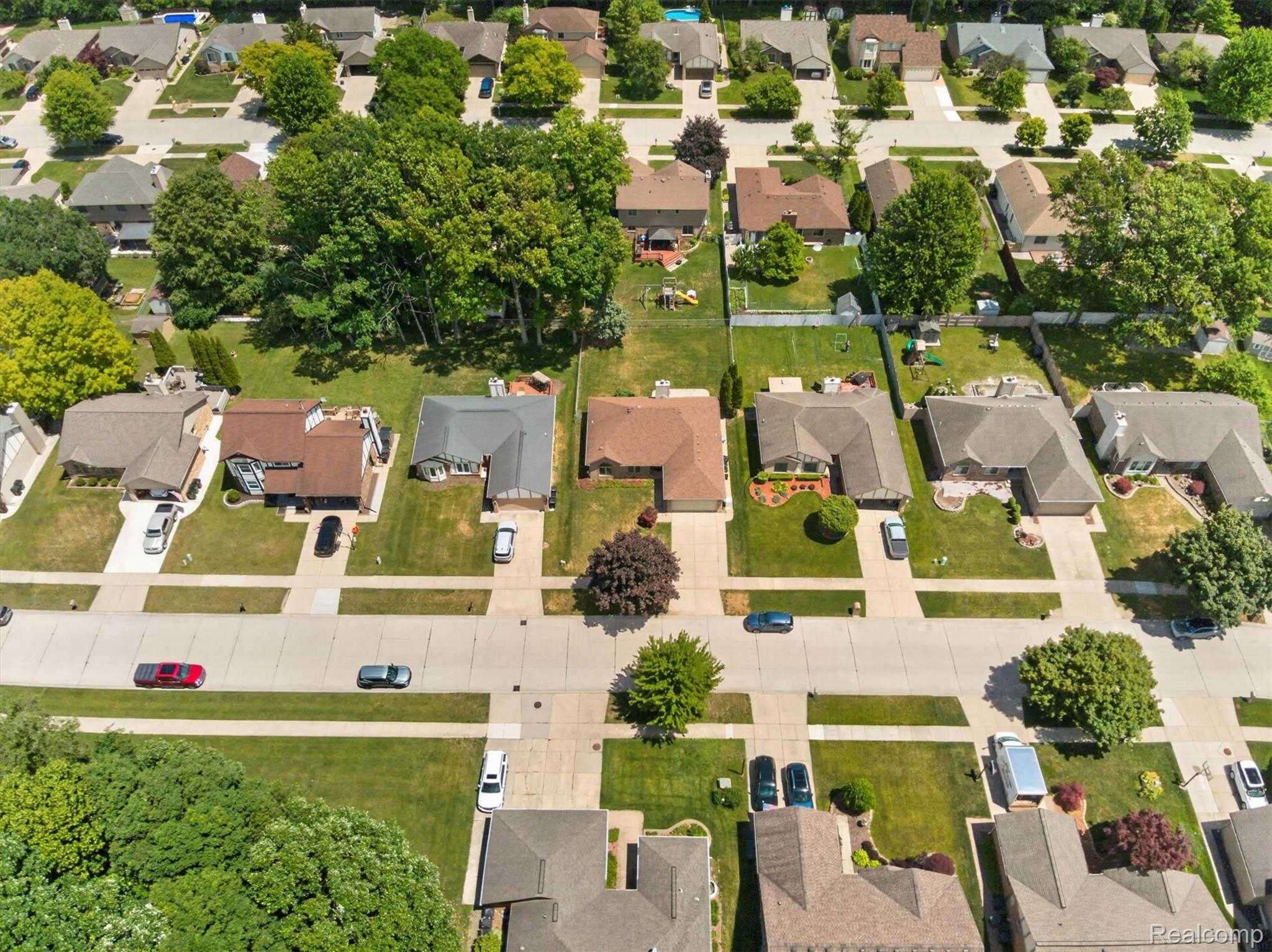 46362 Springhill Drive Utica, MI 48317 - Photo 53 of 59 Aerial perspective showcasing residential properties with established landscaping and paved roadways