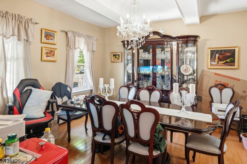 33 Pulaski Place Hackensack, NJ 07601 - Photo 14 of 31 a view of a dining room with furniture and chandelier