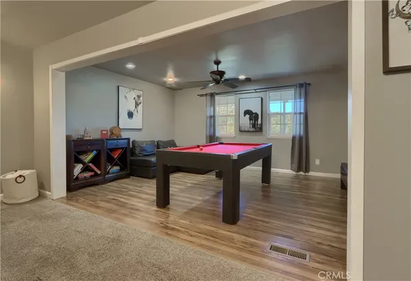 a view of a room with furniture and window