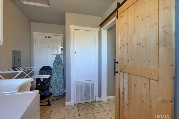a view of a hallway with a storage & utility room