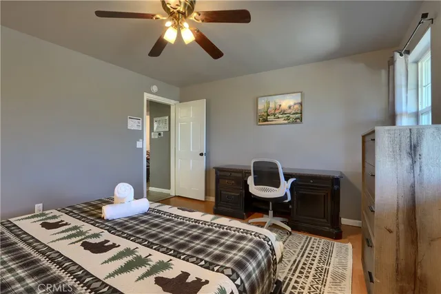 a bedroom with a bed and a chair