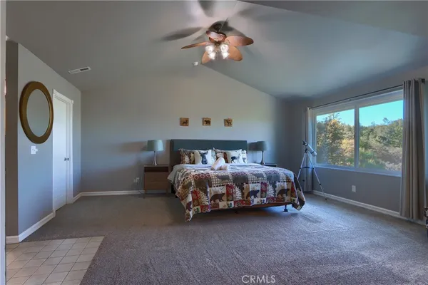 a bed sitting in a room next to a window