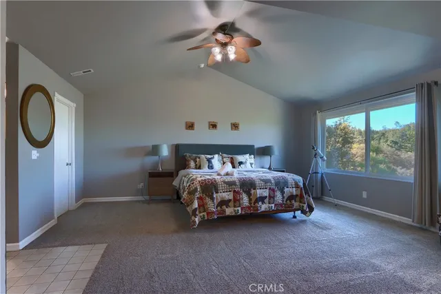 a bed sitting in a room next to a window