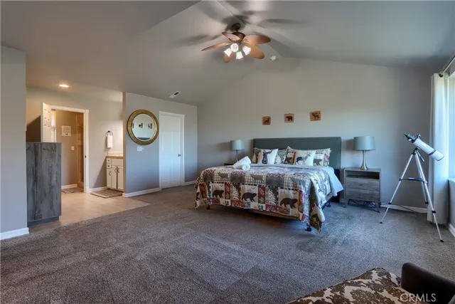 a bedroom with a bed and a chair