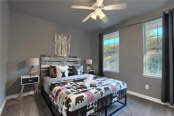 a bedroom with a bed and window