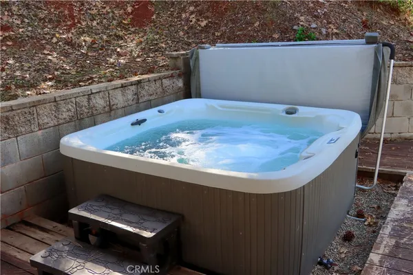 a view of a small yard in front of a house with a fountain