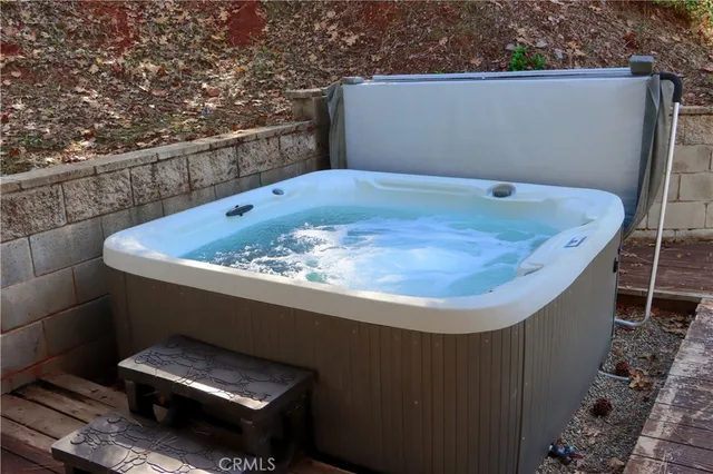 a view of a small yard in front of a house with a fountain