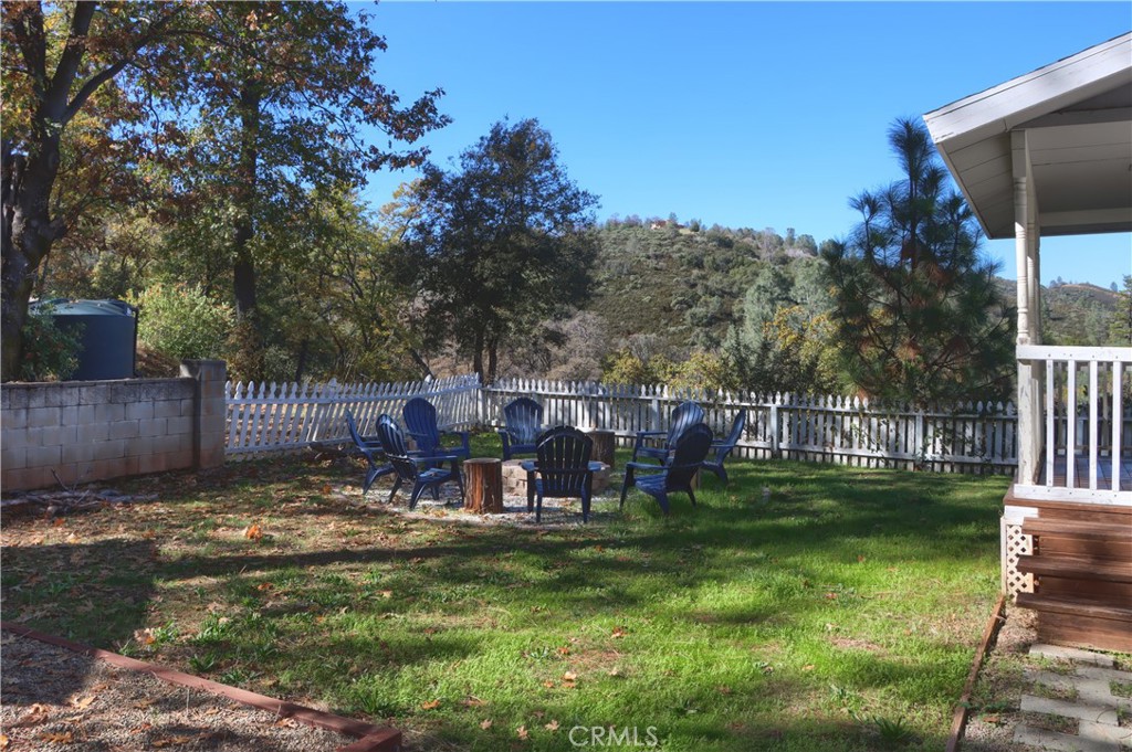 5197 Colorado Road Midpines, CA 95345 - Photo 39 of 47 a view of a small yard in front of a house with a fountain