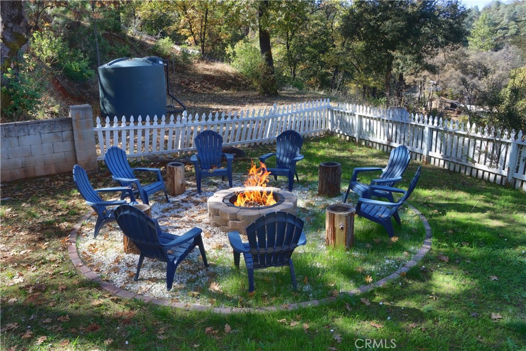 5197 Colorado Road Midpines, CA 95345 - Photo 40 of 47 a wooden bench sitting in the middle of a yard