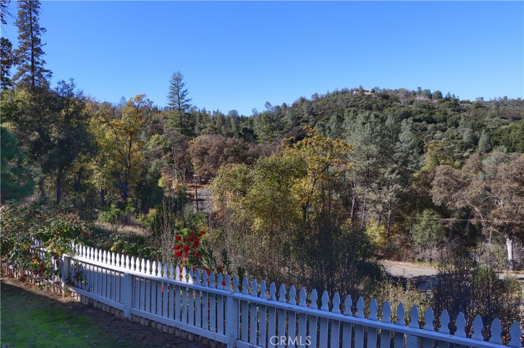 5197 Colorado Road Midpines, CA 95345 - Photo 43 of 47 a view of a balcony with a forest
