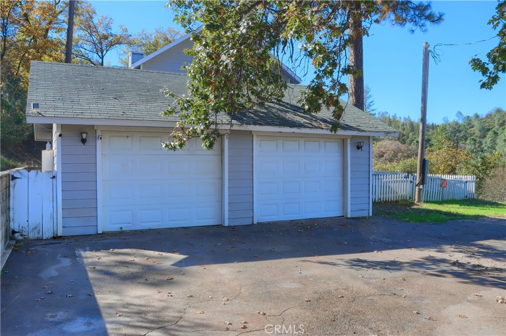 5197 Colorado Road Midpines, CA 95345 - Photo 45 of 47 a front view of a house with a yard and garage