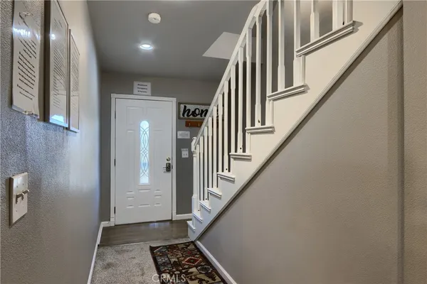 a view of staircase with lots of frames and stairs