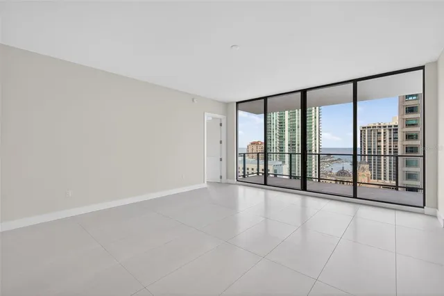 a bathroom with double vanity sinks and a shower