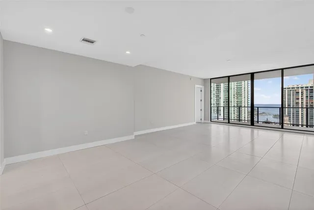a bathroom with a granite countertop sink a toilet and a mirror