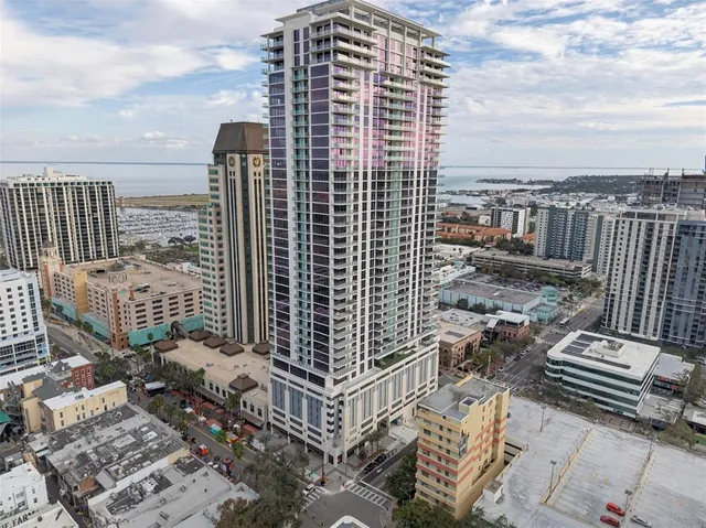 a view of kitchen with kitchen island and natural light