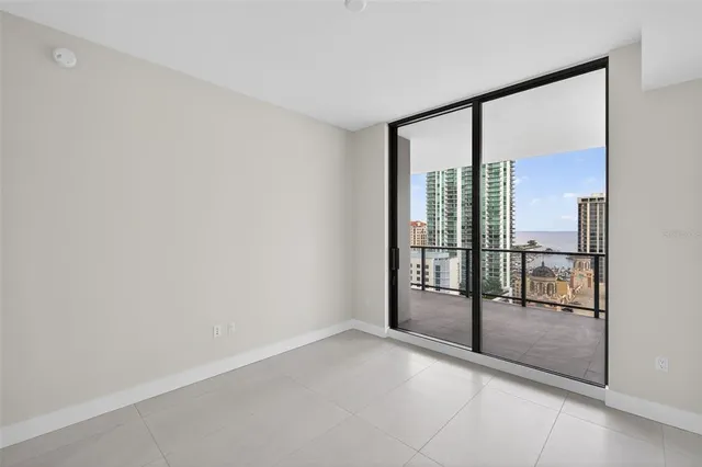 a view of an empty room and closet area