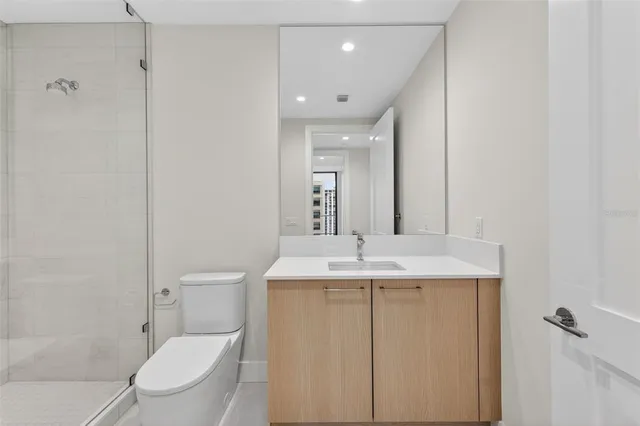 a view of a patio with couches and table and chairs and floor to ceiling window