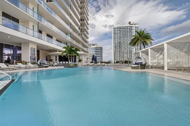 an aerial view of a house with outdoor space and parking