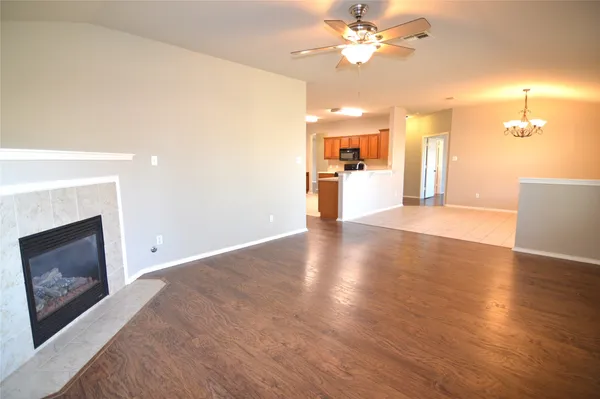 a view of a kitchen with a sink and chandelier