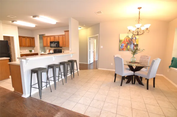 a view of a livingroom with a ceiling fan and window