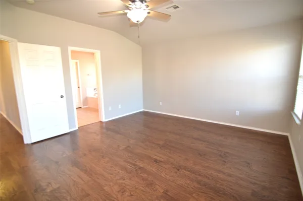 a view of an empty room with a window