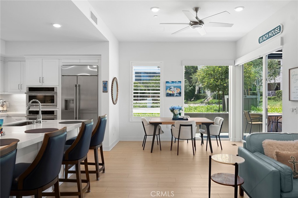 Open concept floor plan with high ceilings. Corner lot is wide open inviting an abundance of natural light. Custom shutters along with automatic roller shades and blackout screen for pure privacy mode.